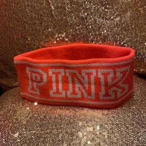 Victoria’s Secret winter headband in neon pink/coral with white PINK logo